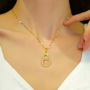 18k GP Double Cross Over Circle CZ Pendant